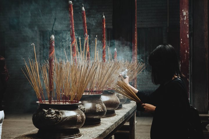 burning incense in temple